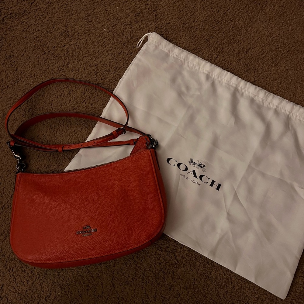 Coach burnt orange cross body/shoulder bag.
